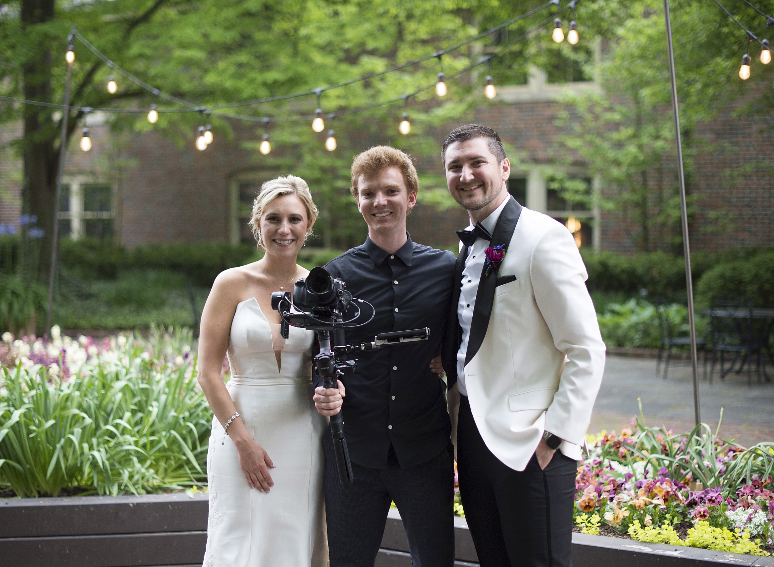 Finn Johnson, founder and lead cinematographer of Ryzein Wedding Films, camera in hand on a wedding day.